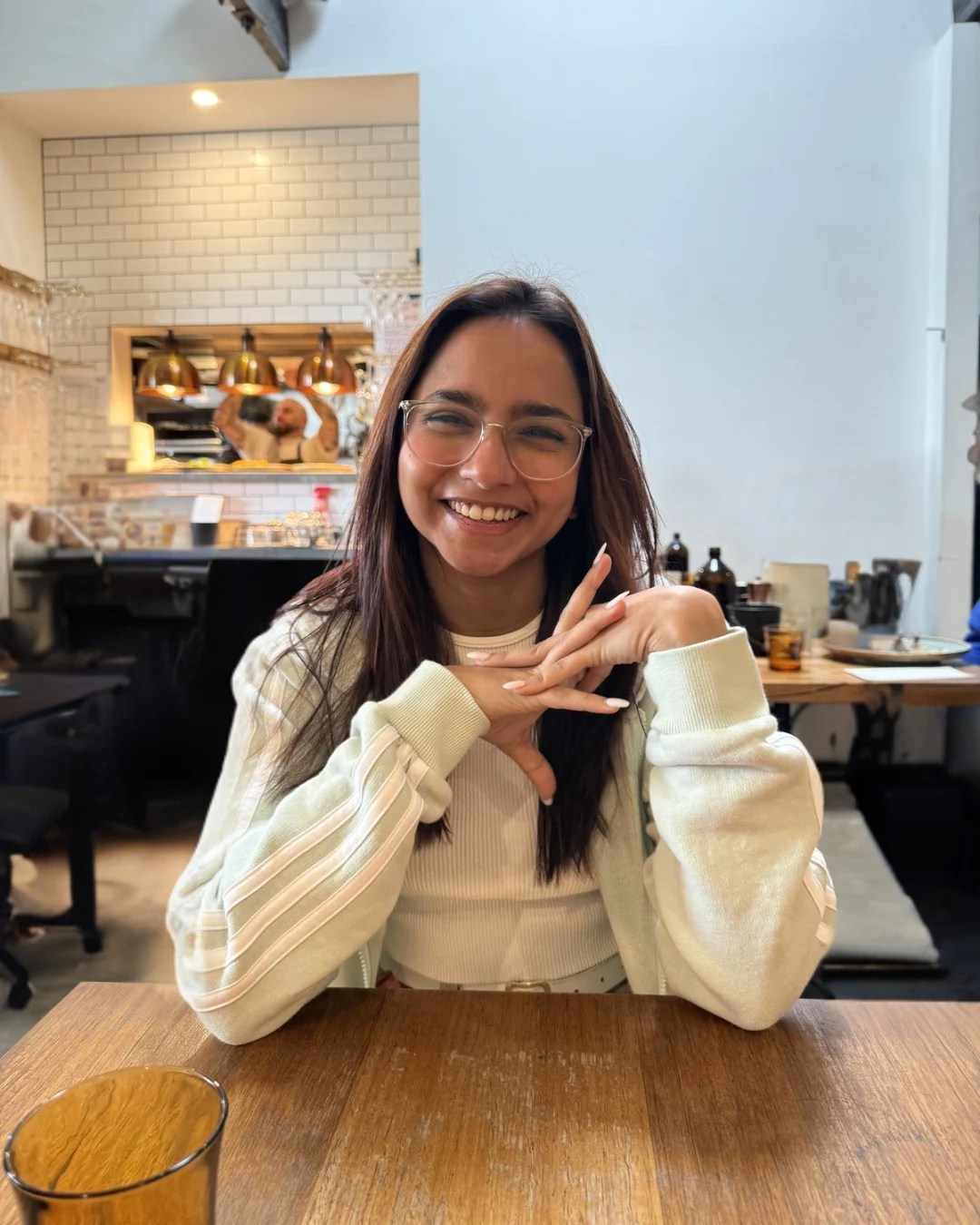 Dulangi smiling in a Melbourne café
