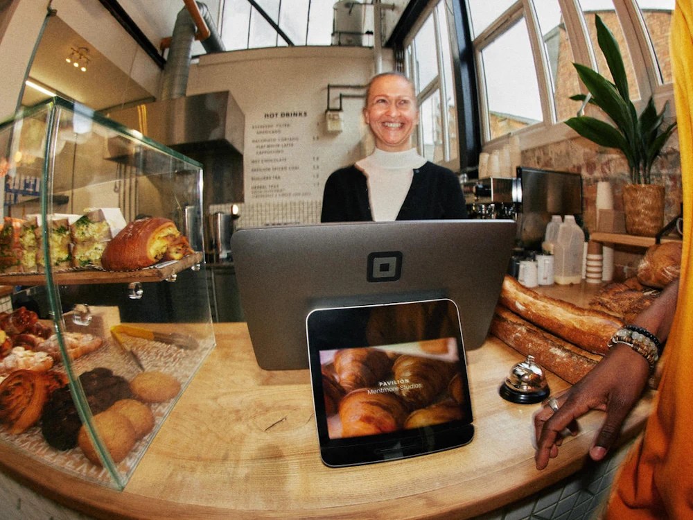 - Healthy Brew Hub A customer orders at a coffee shop using a Square POS system.