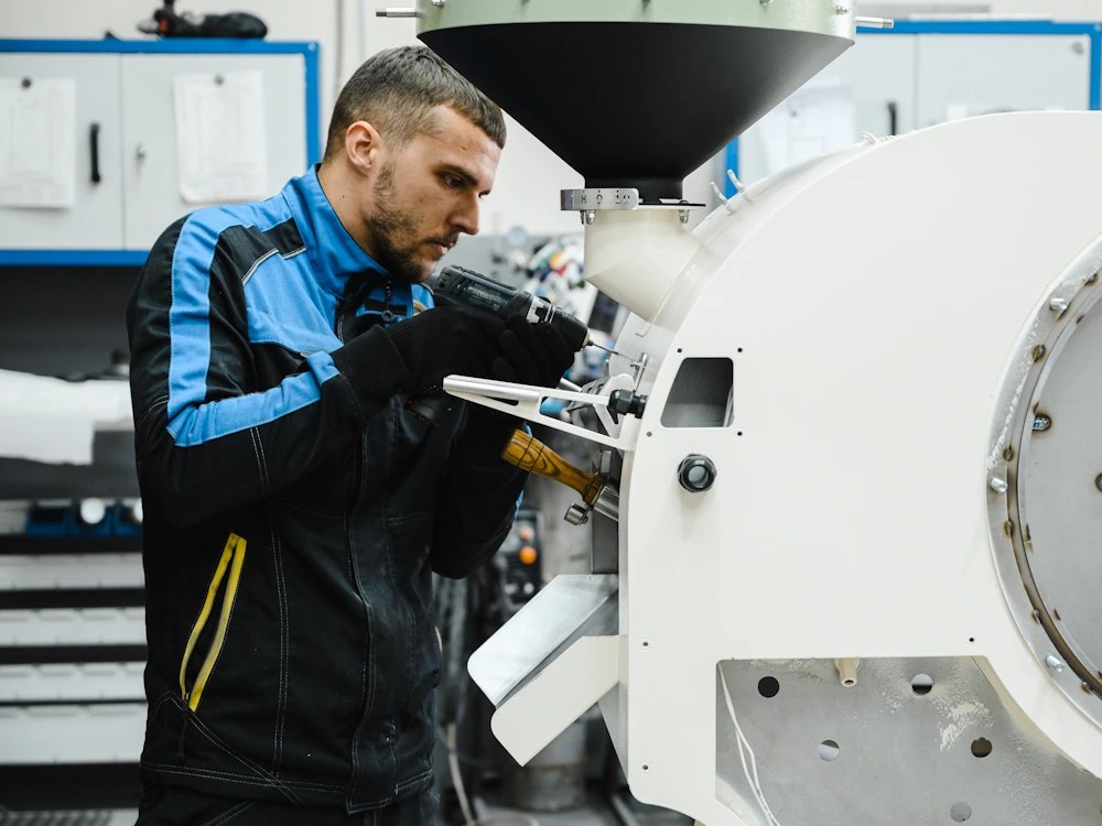 - Healthy Brew Hub An engineer assembles a Typhoon roaster.