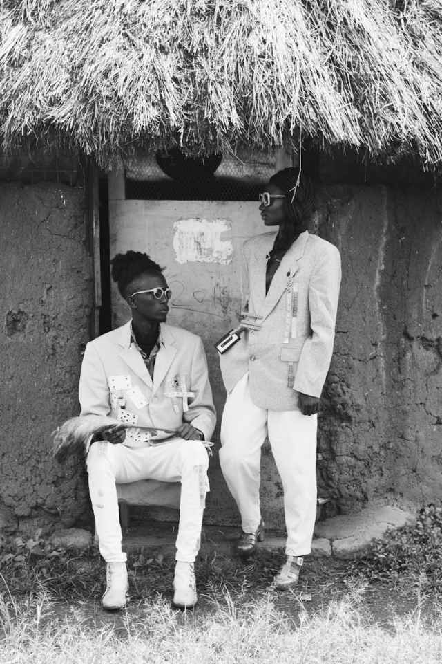 Fashionable young adults pose in traditional Nairobi backdrop, showcasing modern style.
