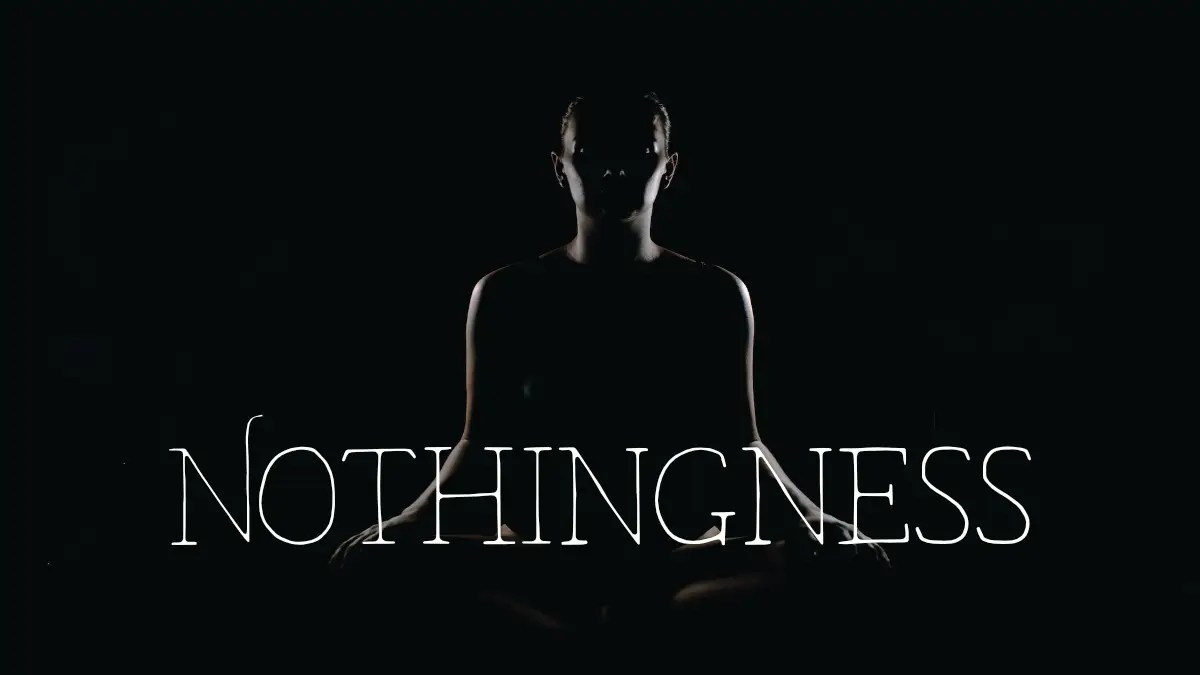 Person in sitting meditation pose behind the word: nothingness