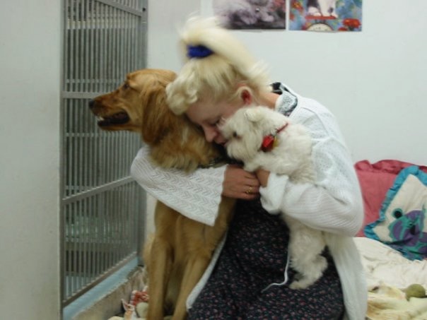 Theresa Garcia is a fierce advocate for lost pets that deserve veterinary care. Here, comforting two canines.