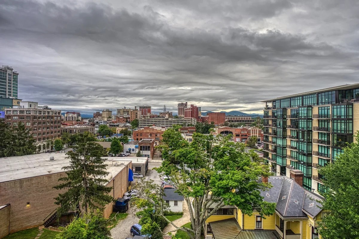 Historical photograph of Asheville cityscape; not current foliage or access evidence