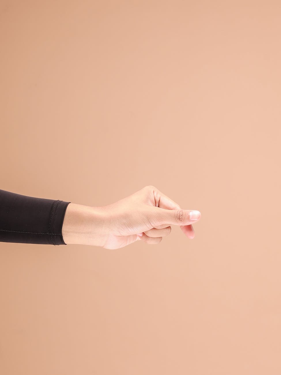 minimalist hand gesture on neutral background