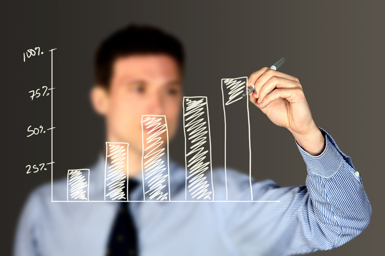man drawing a chart pricing for phase4studios