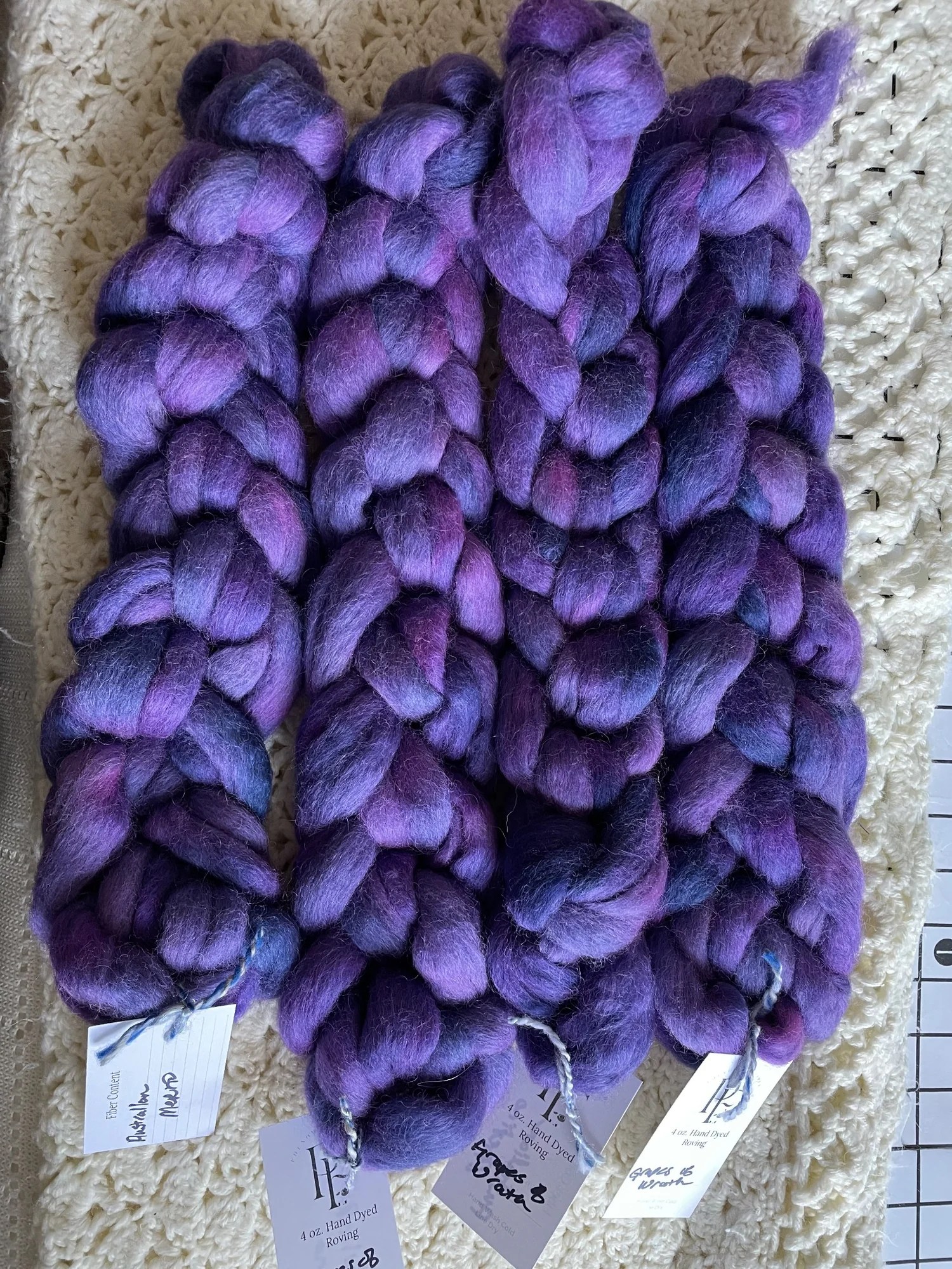Braids of Australian Merino wool in deep purple and lavender tones.