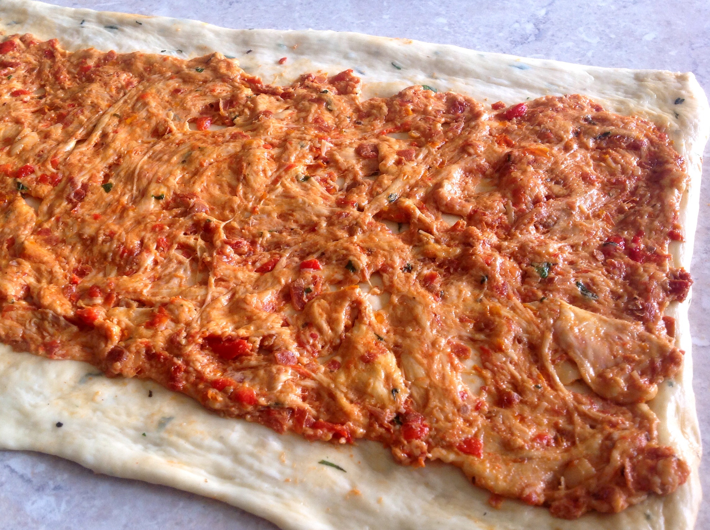 Place the tomato dough over