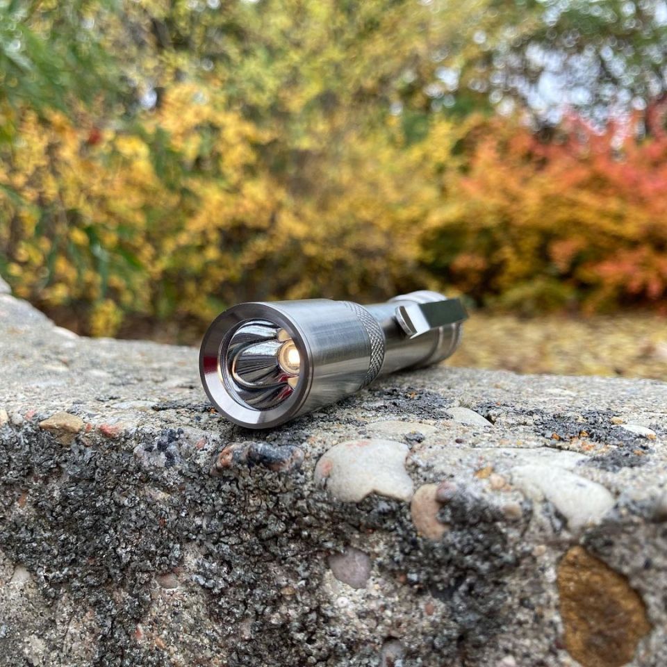 Copper and Current Hinton AA flashlight in titanium being produced by Focus Works