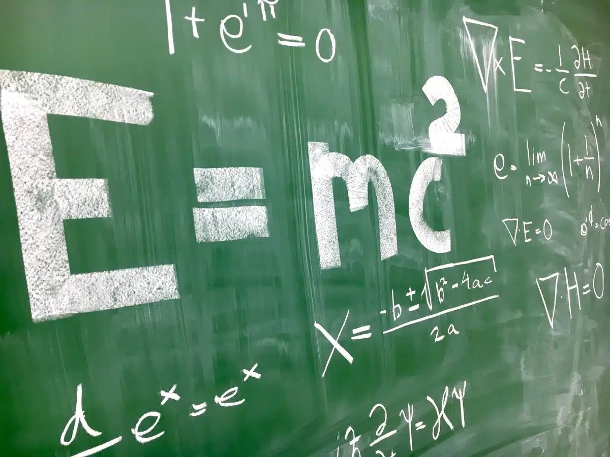 Physics formulas written on a whiteboard /chalkboard