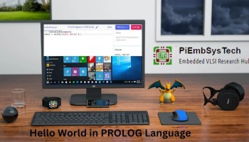 A computer setup displaying a "Hello World" program written in Prolog on the screen. Various desktop items including a smart watch, a smartphone, a toy dragon figure, a mouse, and headphones are arranged neatly around the computer.
