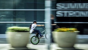 man riding bicycle in city