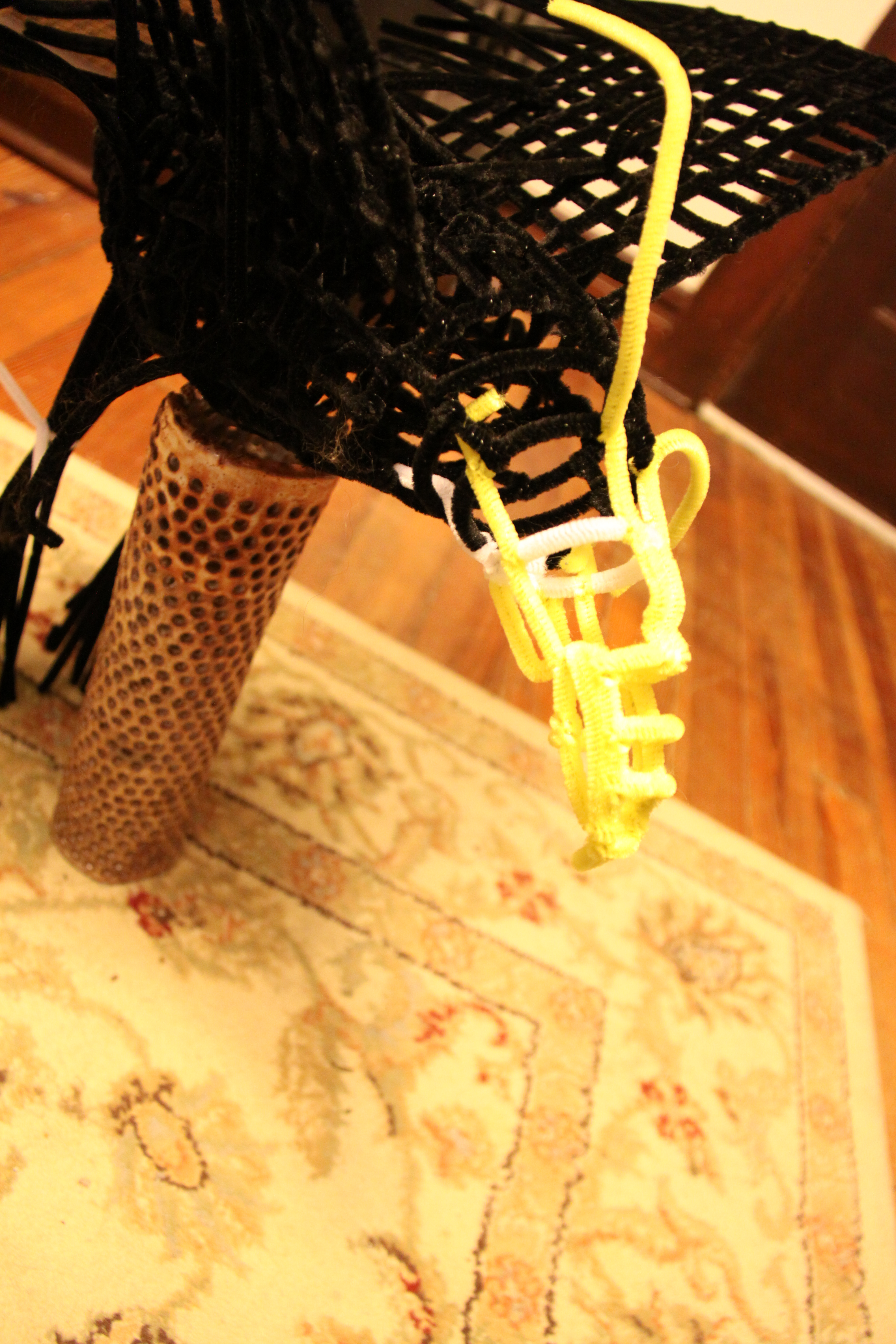 Pipe cleaner eagle frame under construction, showing the beak