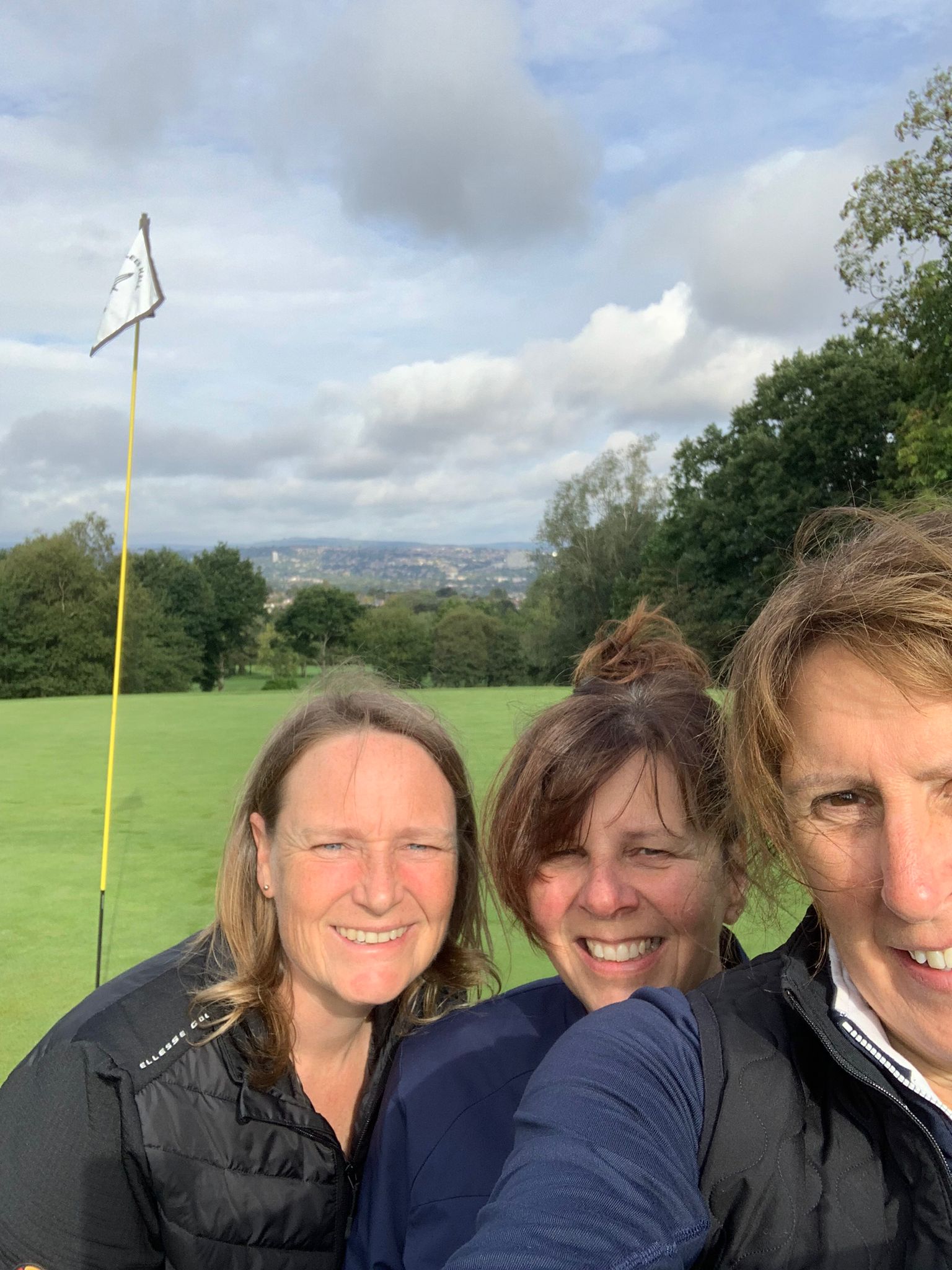 Pip on the Tee with friends on the green