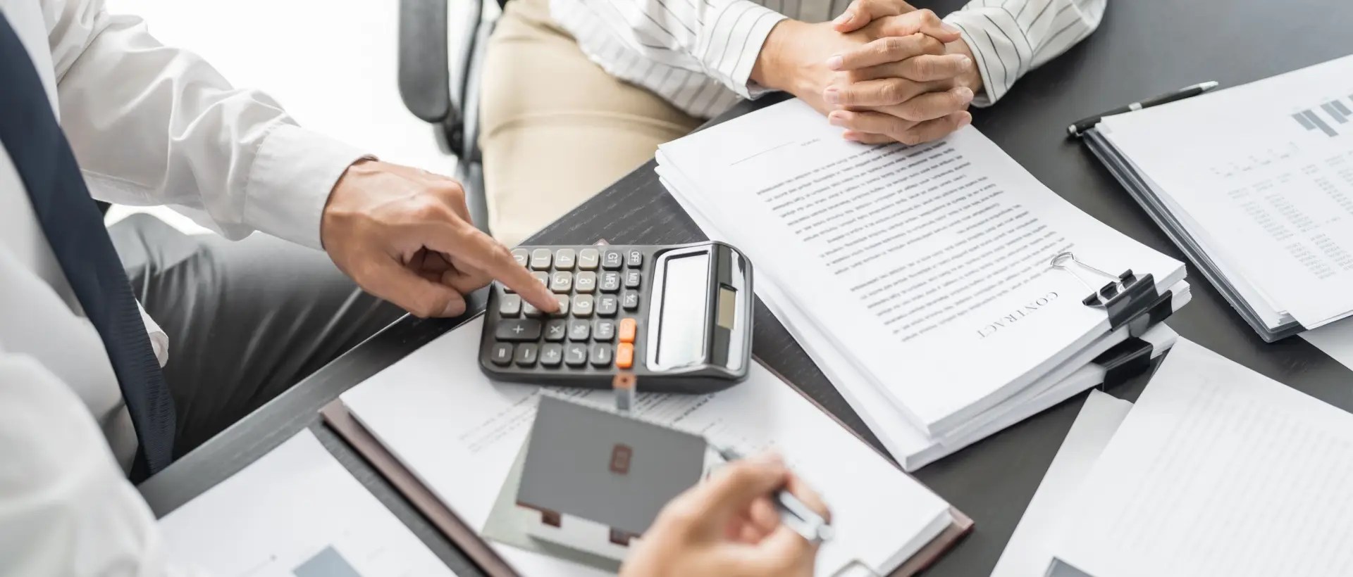 Person using a roofing loan calculator