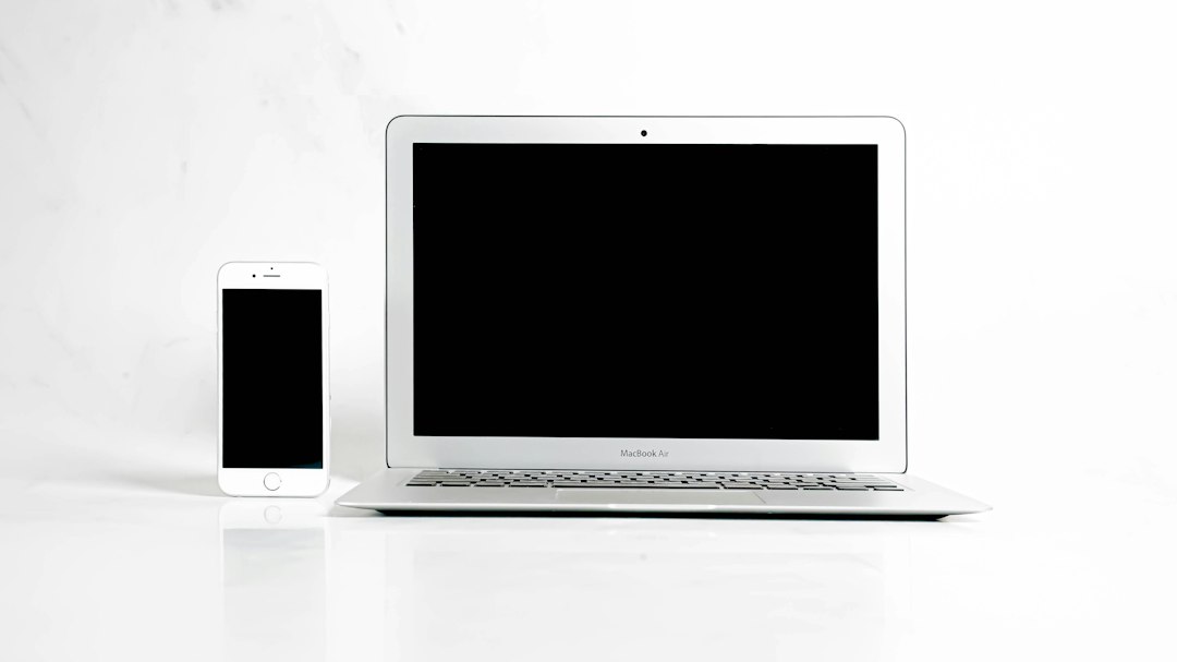 Laptop and smartphone photographed as clean e-commerce products