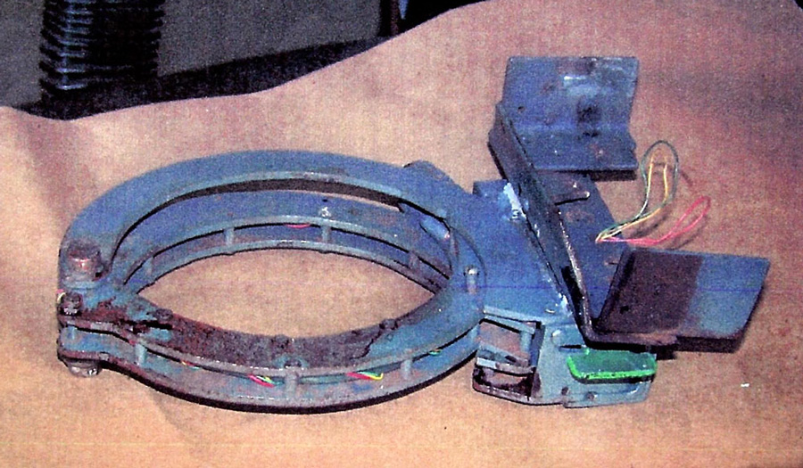 The metal collar that held the bomb to Brian Wells was intact after the explosion; it operated like a large handcuff that was locked to his neck. The metal box that held the bomb mechanism was attached to the frame of the collar. RICH FORSGREN/ERIE TIMES NEWS, via FBI
