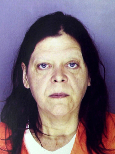 Marjorie Diehl-Armstrong, in the mug shot Erie police took of her after she was arrested in the shooting death of her live-in boyfriend Jim Roden, whose body was found in a freezer on September 21, 2003. Nearly four years later, a federal grand jury would indict her in the Brian Wells pizza bomber case and allege she killed Roden to keep him quiet about the bank-robbery plot in which Wells participated. ERIE TIMES-NEWS, via ERIE BUREAU OF POLICE