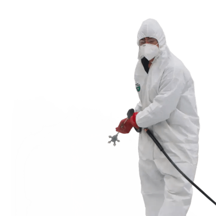a person in white protective suit spraying chemicals