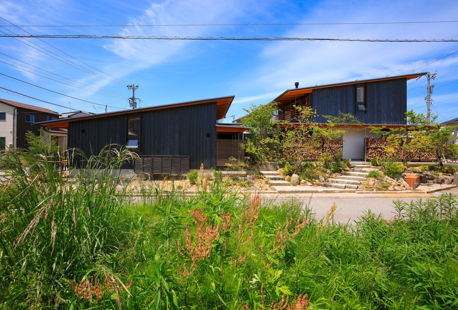 Two Family's Live Side by Side in this Two Volume House in Toyama