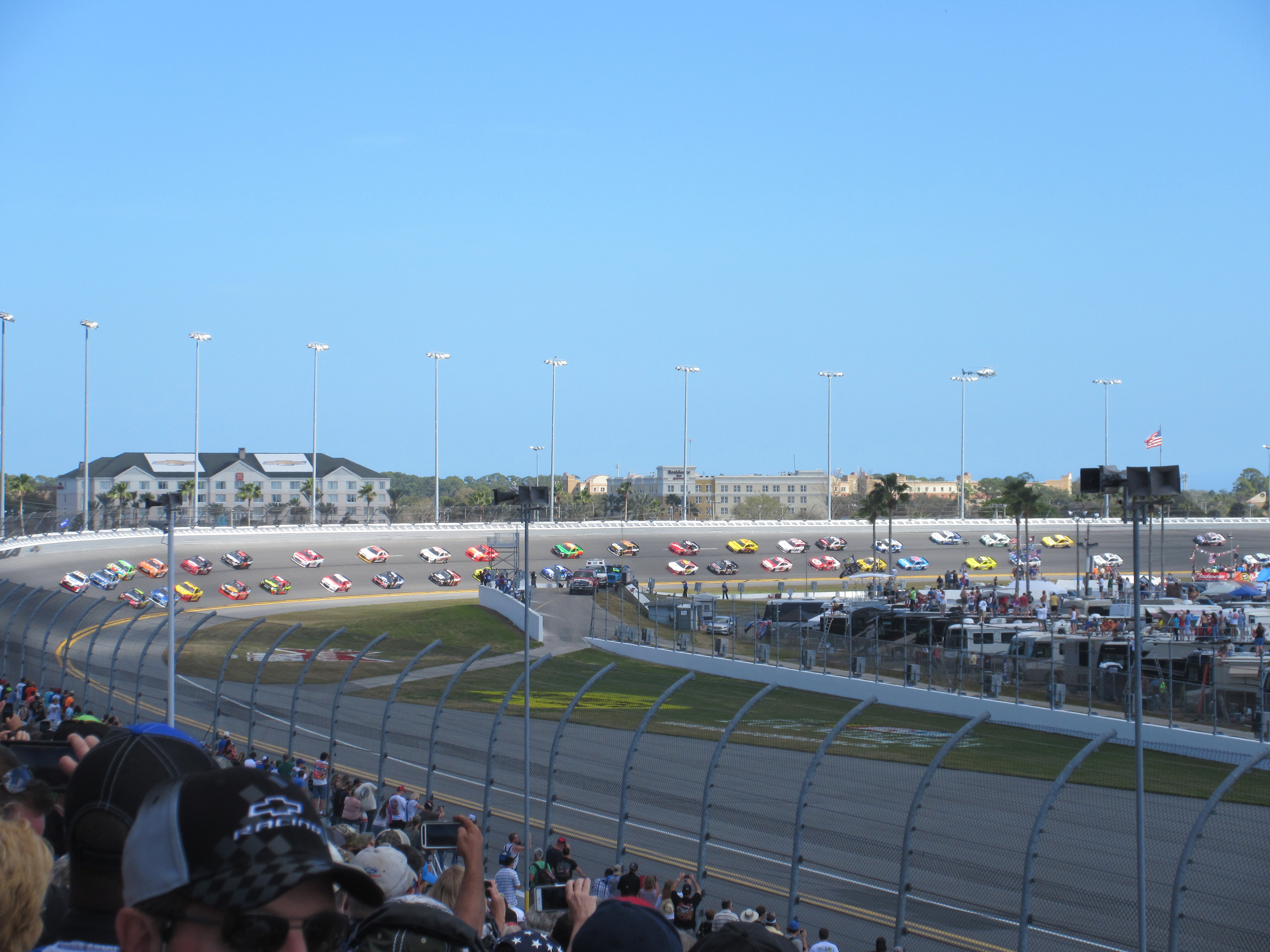 Daytona 500. The cars are sedate and well-spaced because they are following the pace car.