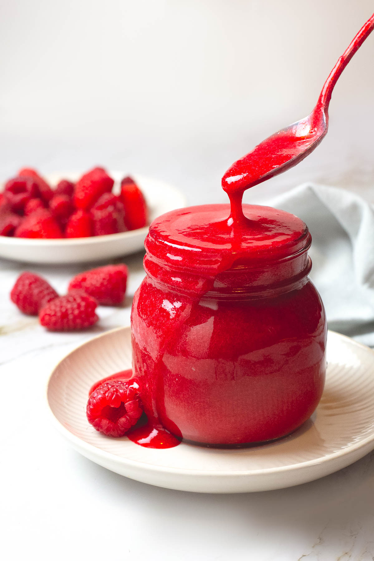 Sugar free raspberry puree inside a glass jar