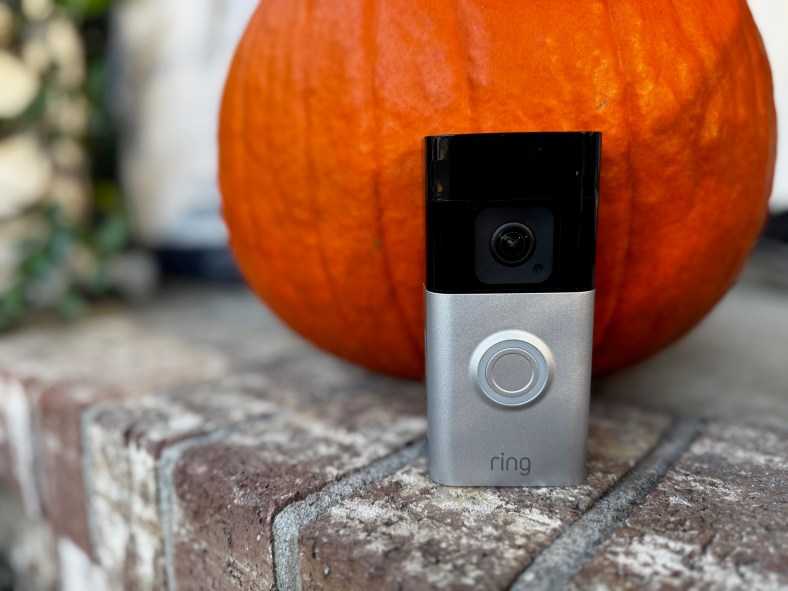 The Ring Battery Doorbell Pro in front of a pumpkin.