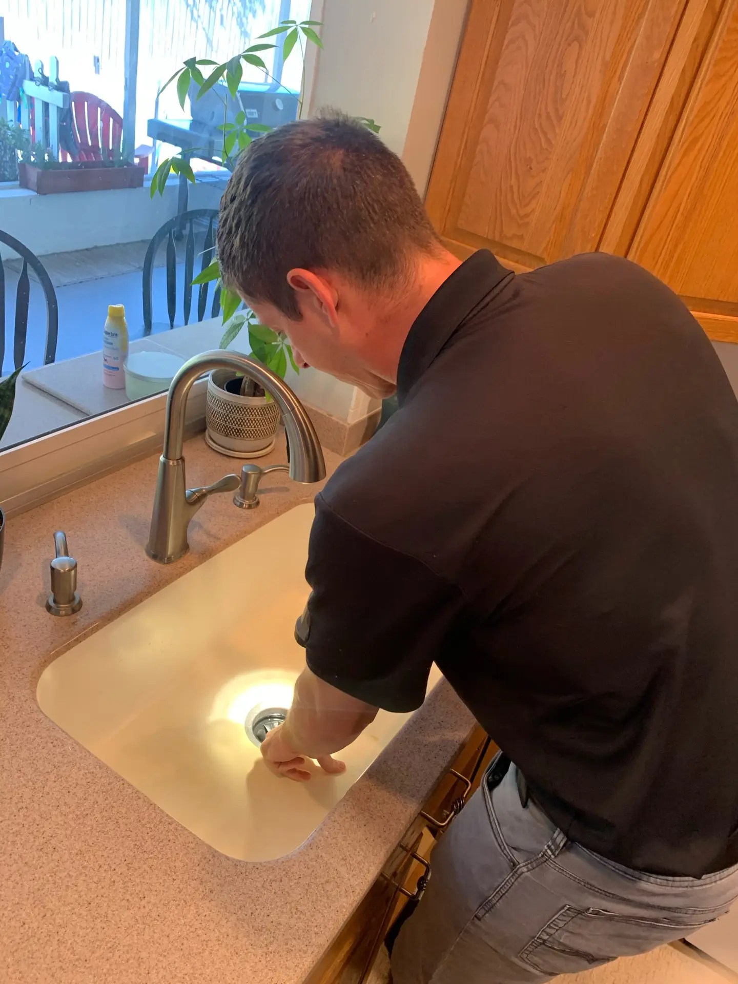 Drain cleaning a garbage disposal connected to kitchen sink