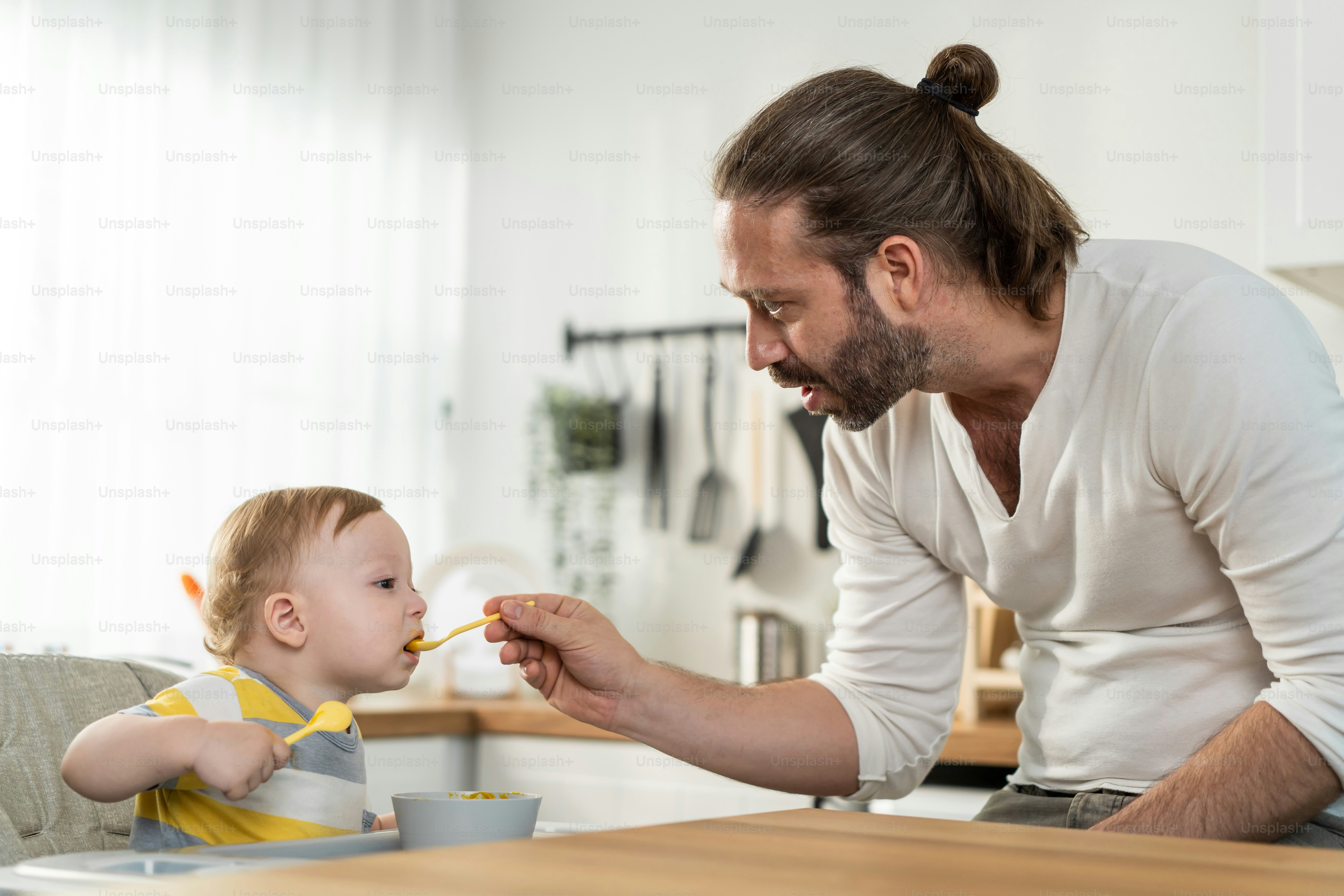 Caucasian Beautiful Father Take Care Of Baby Boy Toddler In Kitchen - Amazing 8K City Illustrations | Free Download