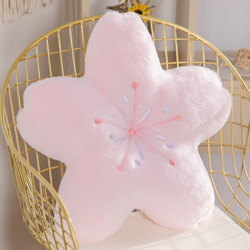 Comfortable pink flower plush on a chair.