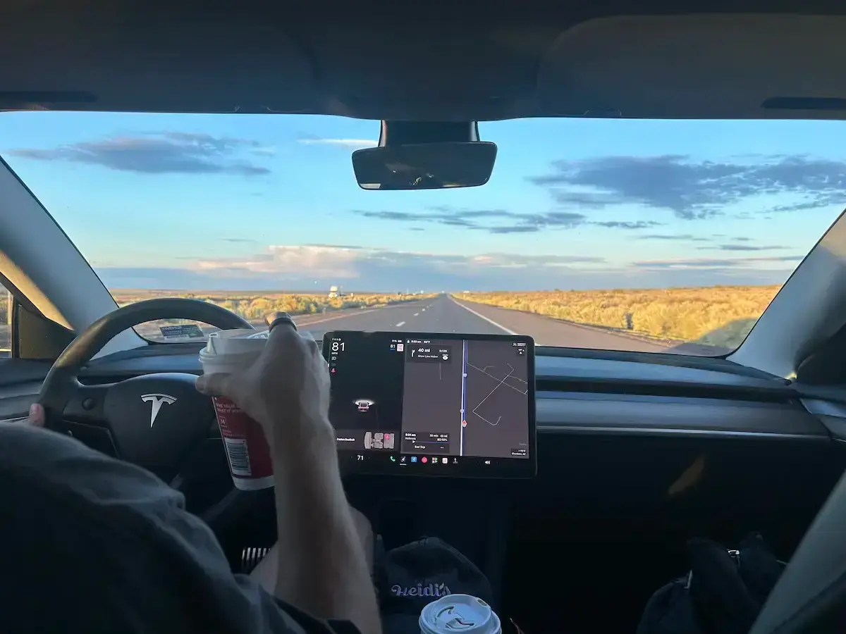 Road trip heading west in a tesla car. 