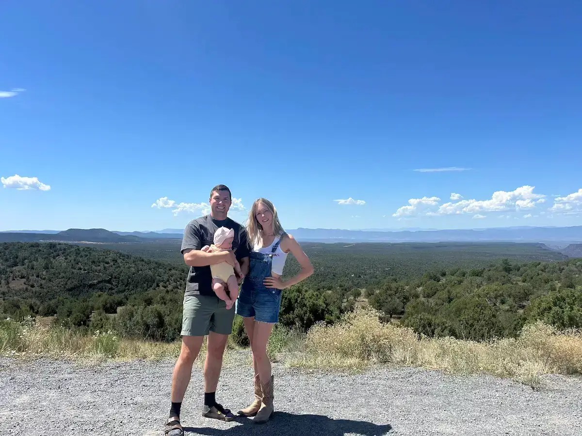 Family photo with a scenic backdrop behind them in northern arizona.
