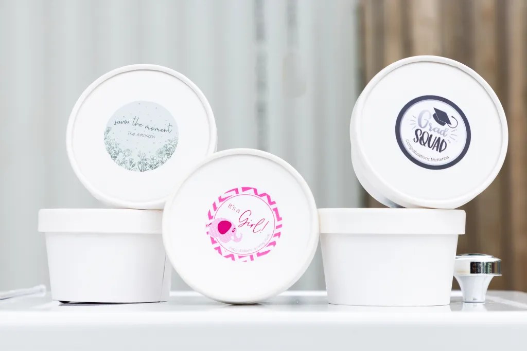 Customized treats and snacks in individual containers for The Trolley catering service.