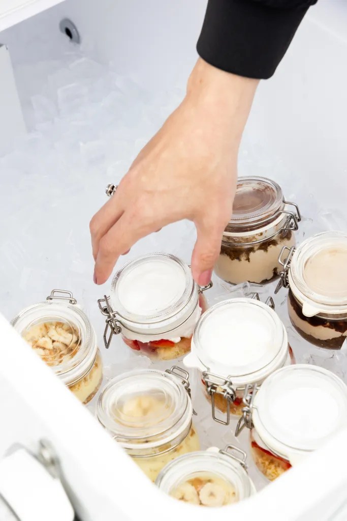 Artisanal sweet treats and custom-packaged desserts in glass jars, The Trolley catering service.