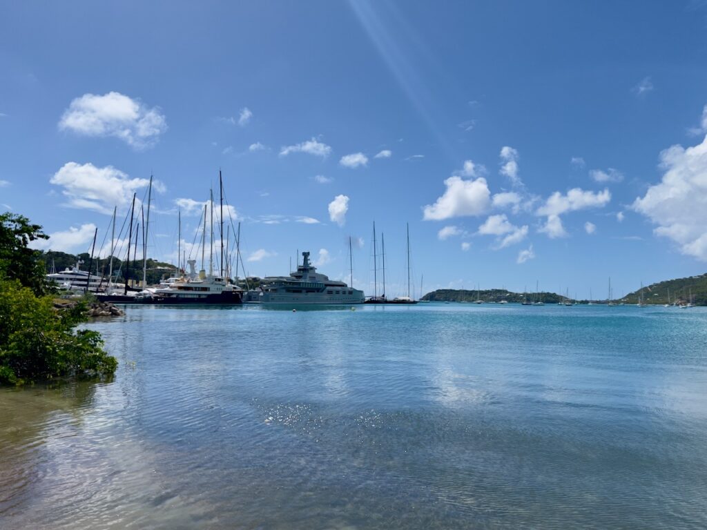 Yachts on calm blue water.