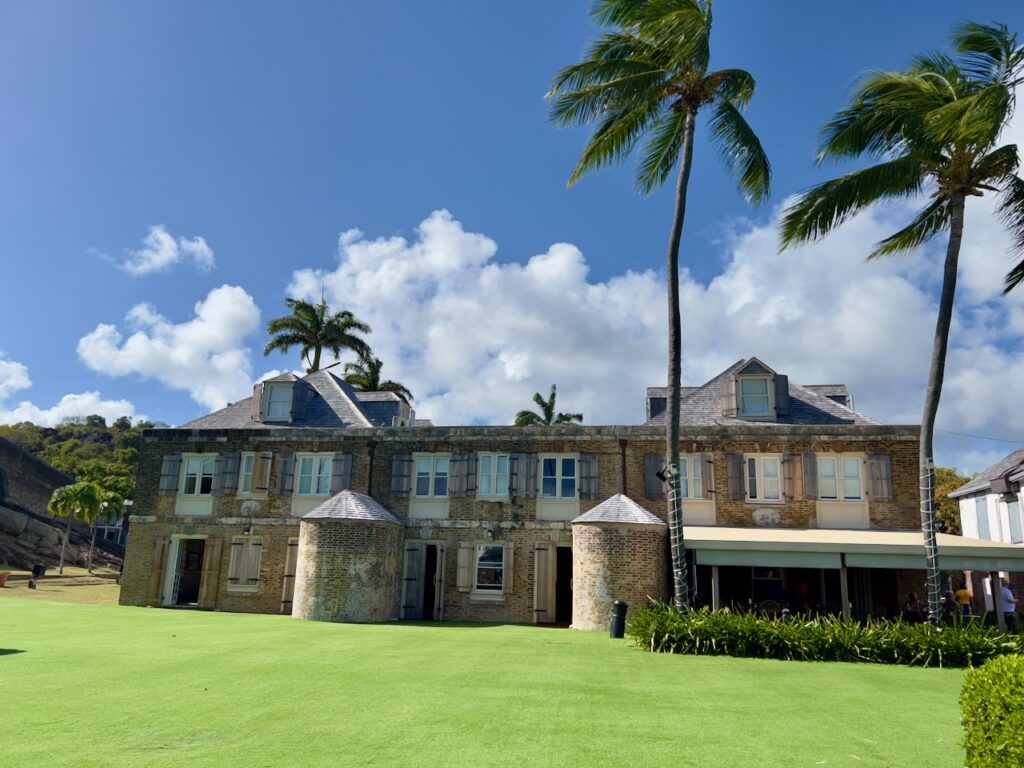 Historic building with palm trees.