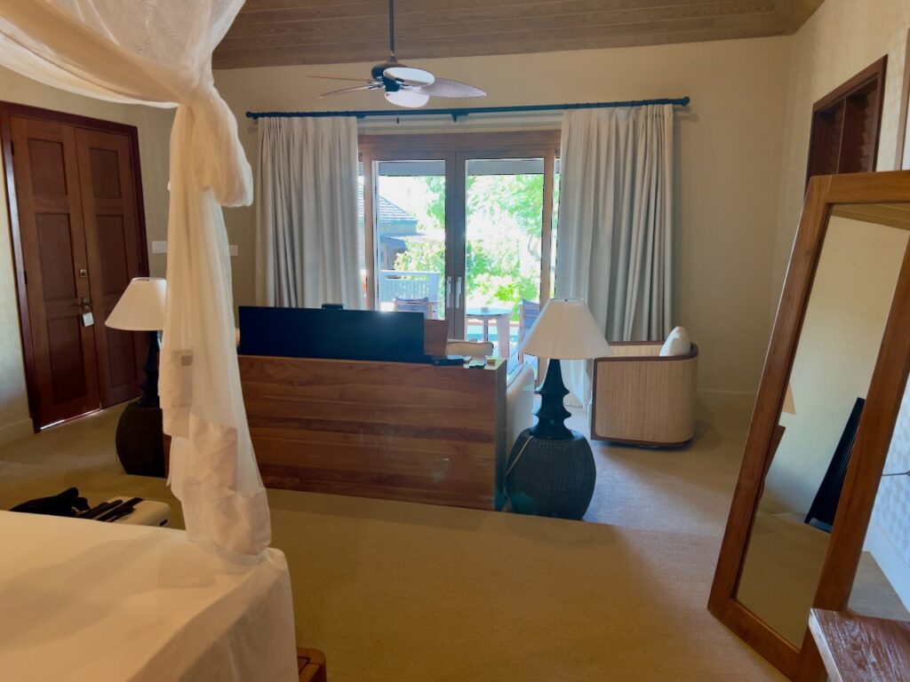 Bright bedroom with large windows.