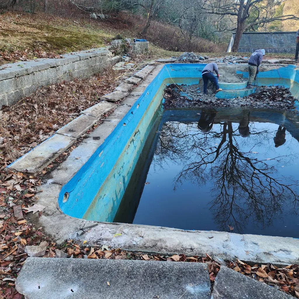 Backyard pool renovation near me in Connecticut with updated decking and modern waterline tile
