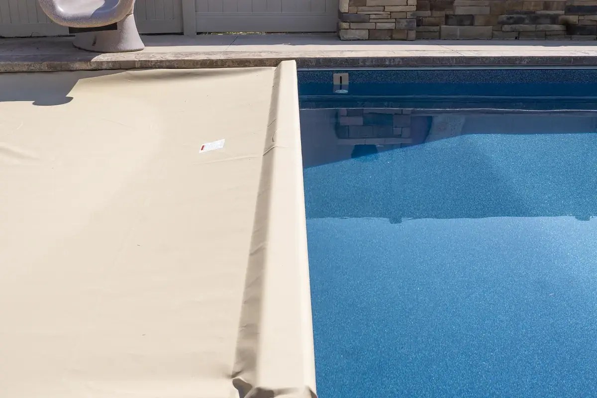 Close-up of an automatic pool cover leading edge