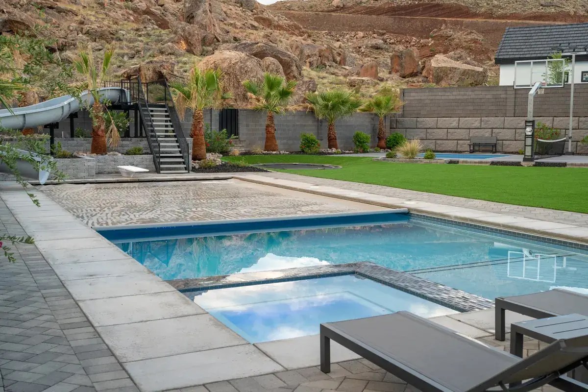 Automatic pool cover switch location view: the whole pool and cover visible from the cover end