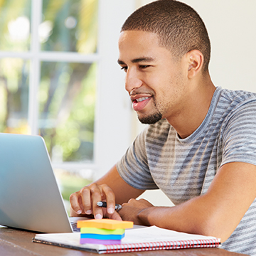 man_at_computerjpg - Portage College