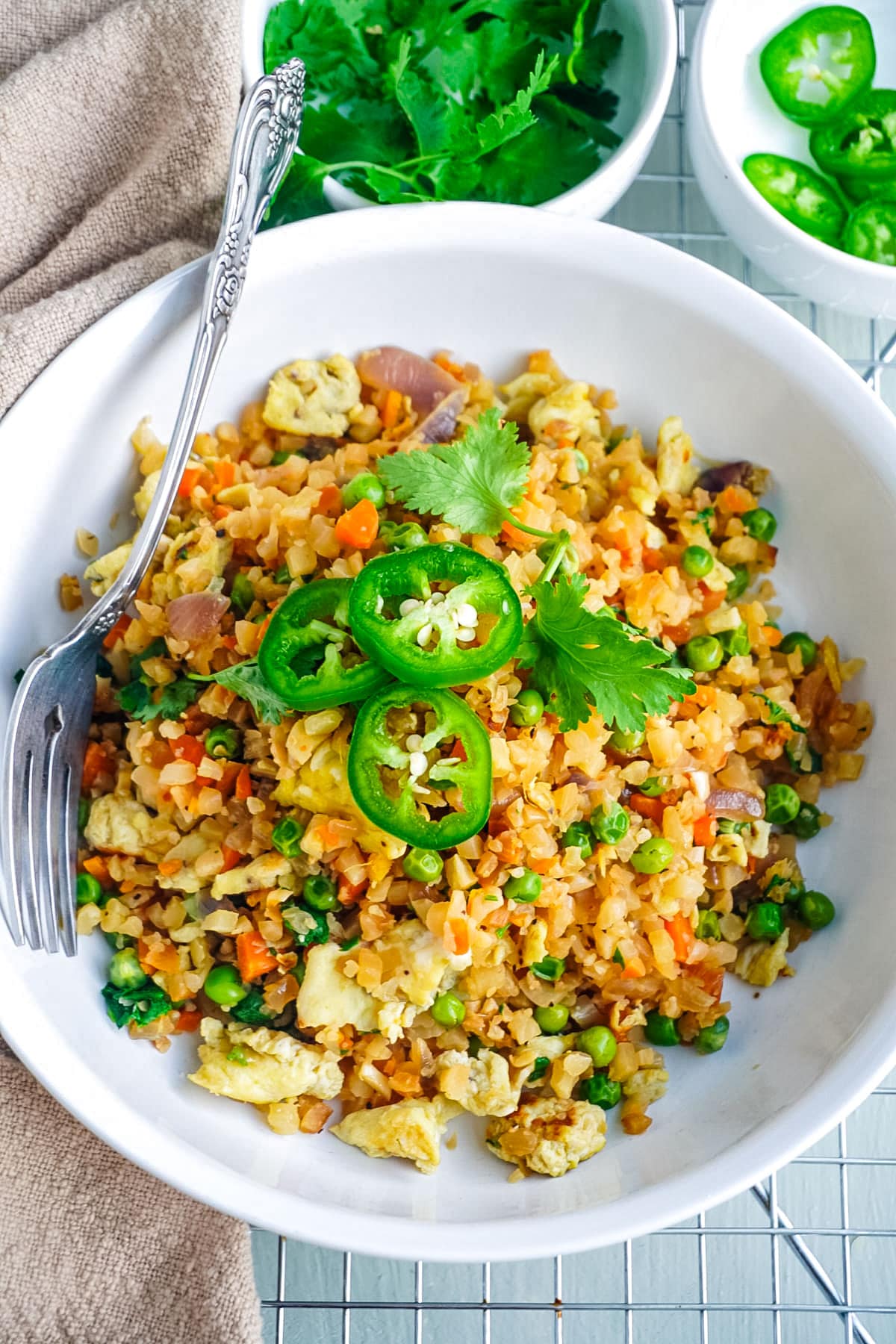 Fried Cauliflower Rice in a bowl garnished with cilantro.