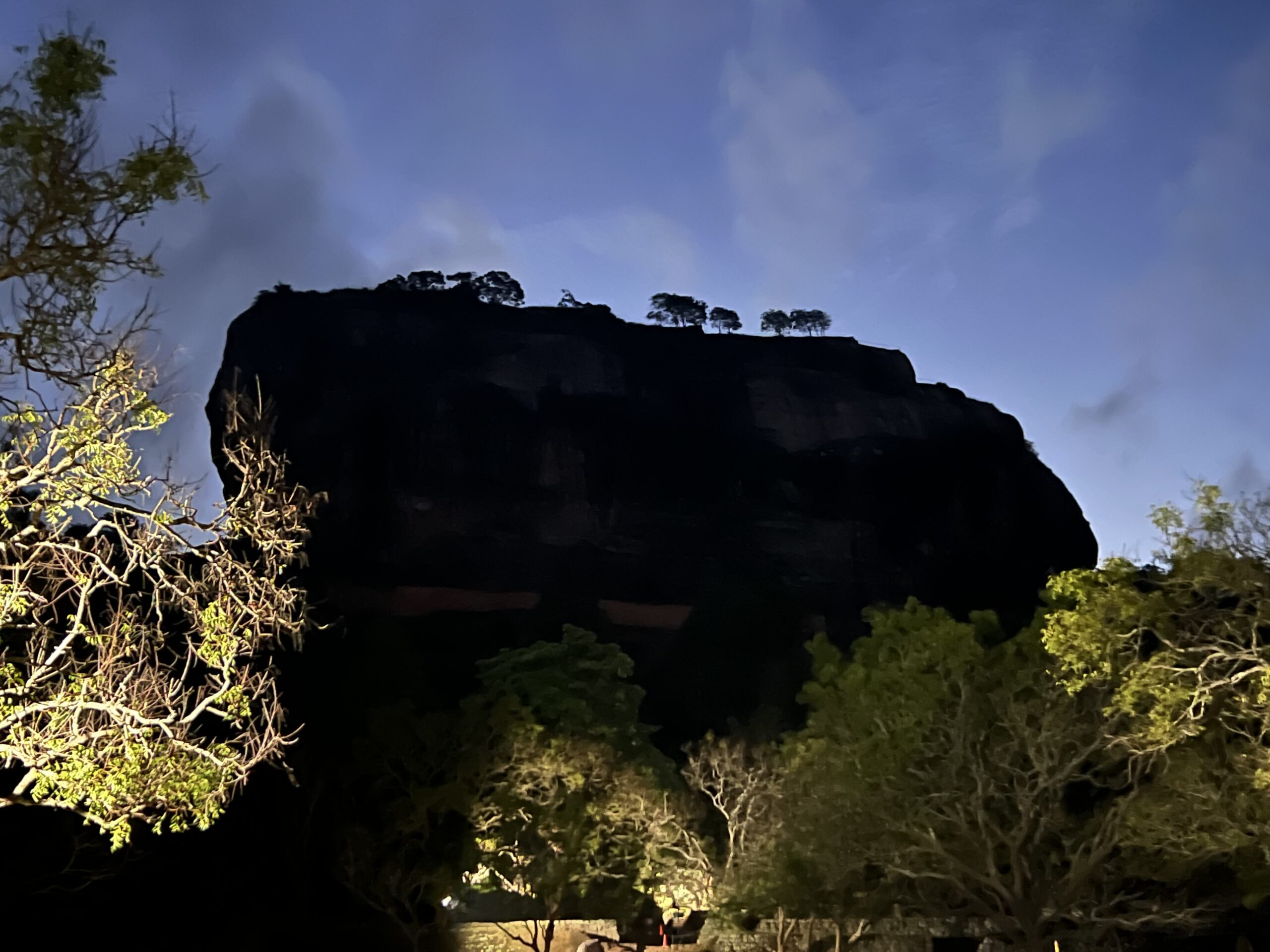 Sigiriya Rock Fortress seen in silhouette at dawn