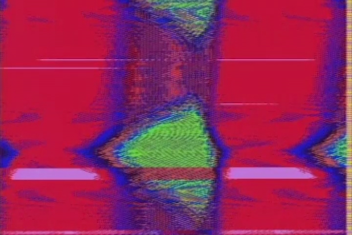 A red screen with a green blur outlined in blue moving across the screen.