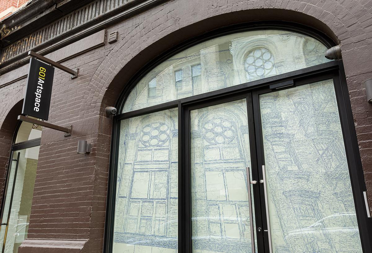 The front window of 601 is replaced with an intricate drawing that traces the contours of the windows’ usual reflection from across Eldridge Street.