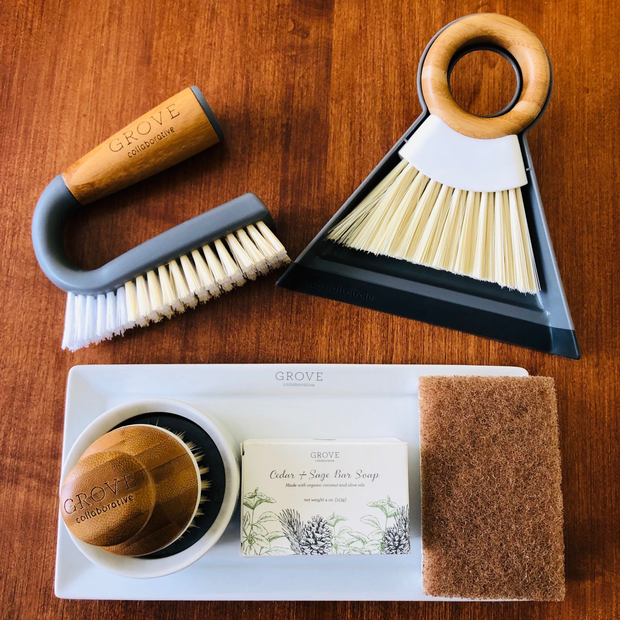grout brush, mini broom & dust pan, bubble up brush, soap, walnut scrubber sponge on tray