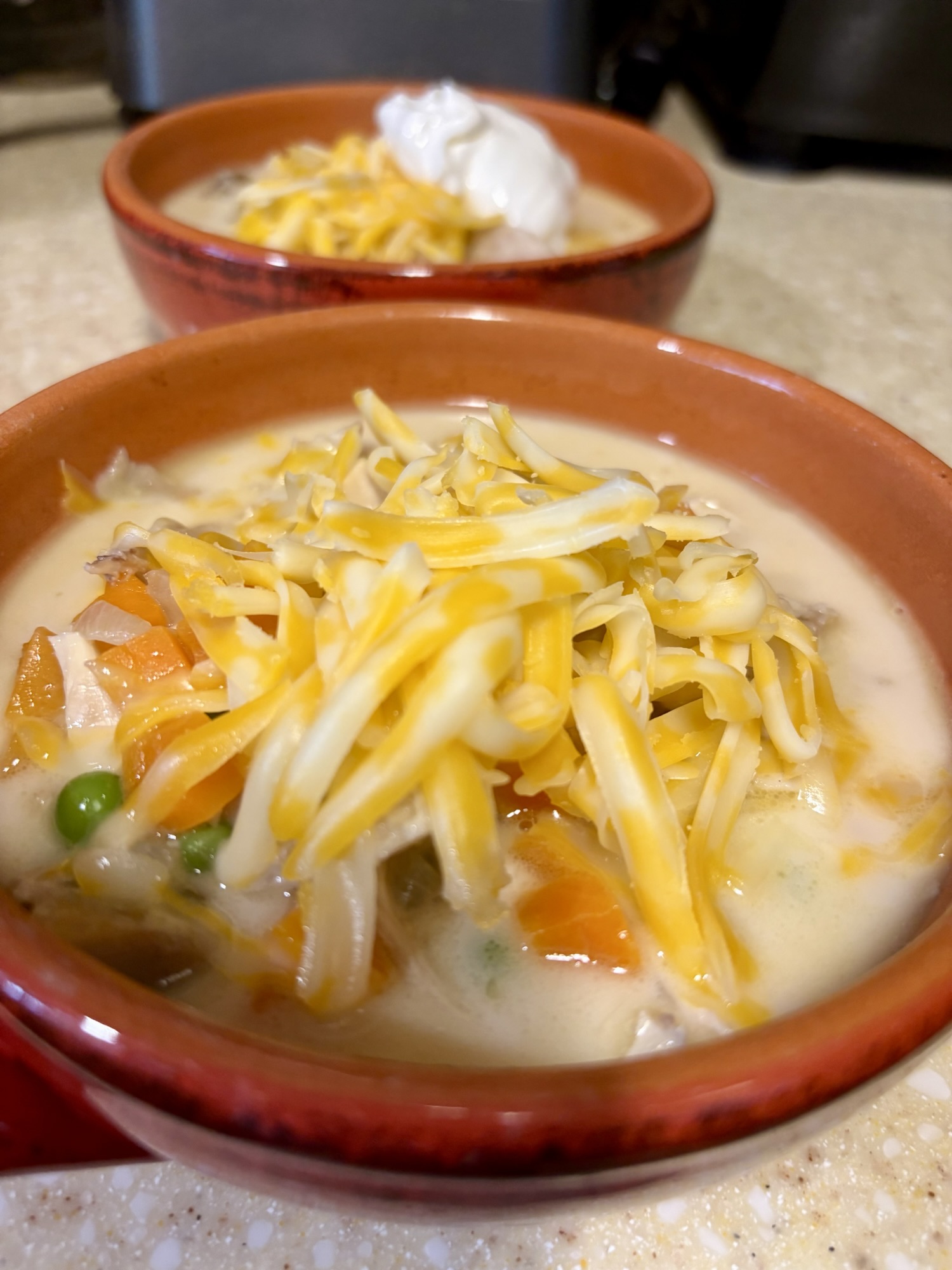 Chicken Pot Pie Soup, piled high with cheese