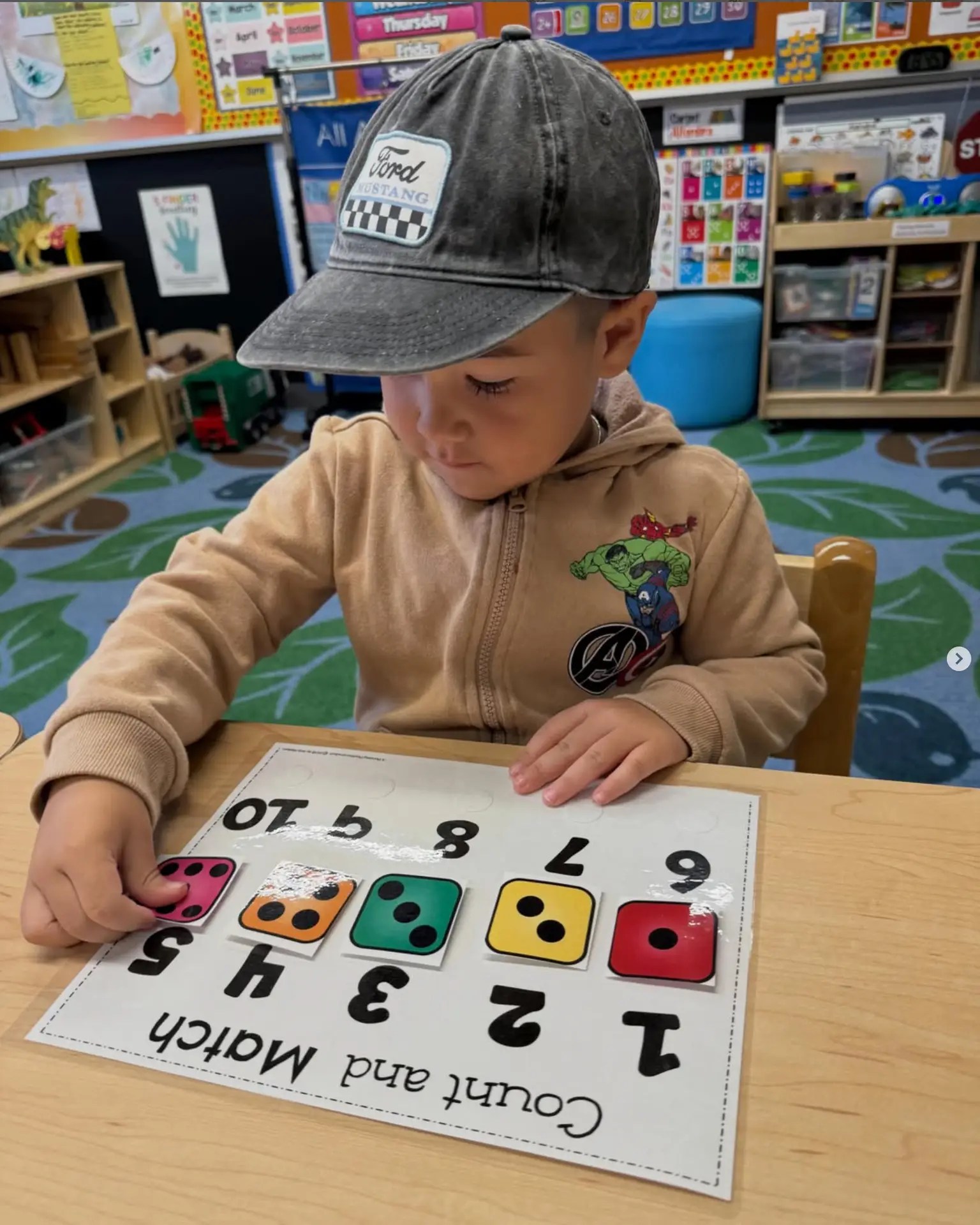 Child learning numbers and pre-math at Precious Lamb Preschool.