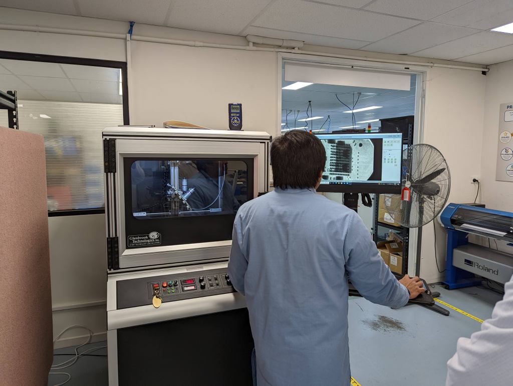 Engineer checking quality issues on a circuit board using an Xray machine