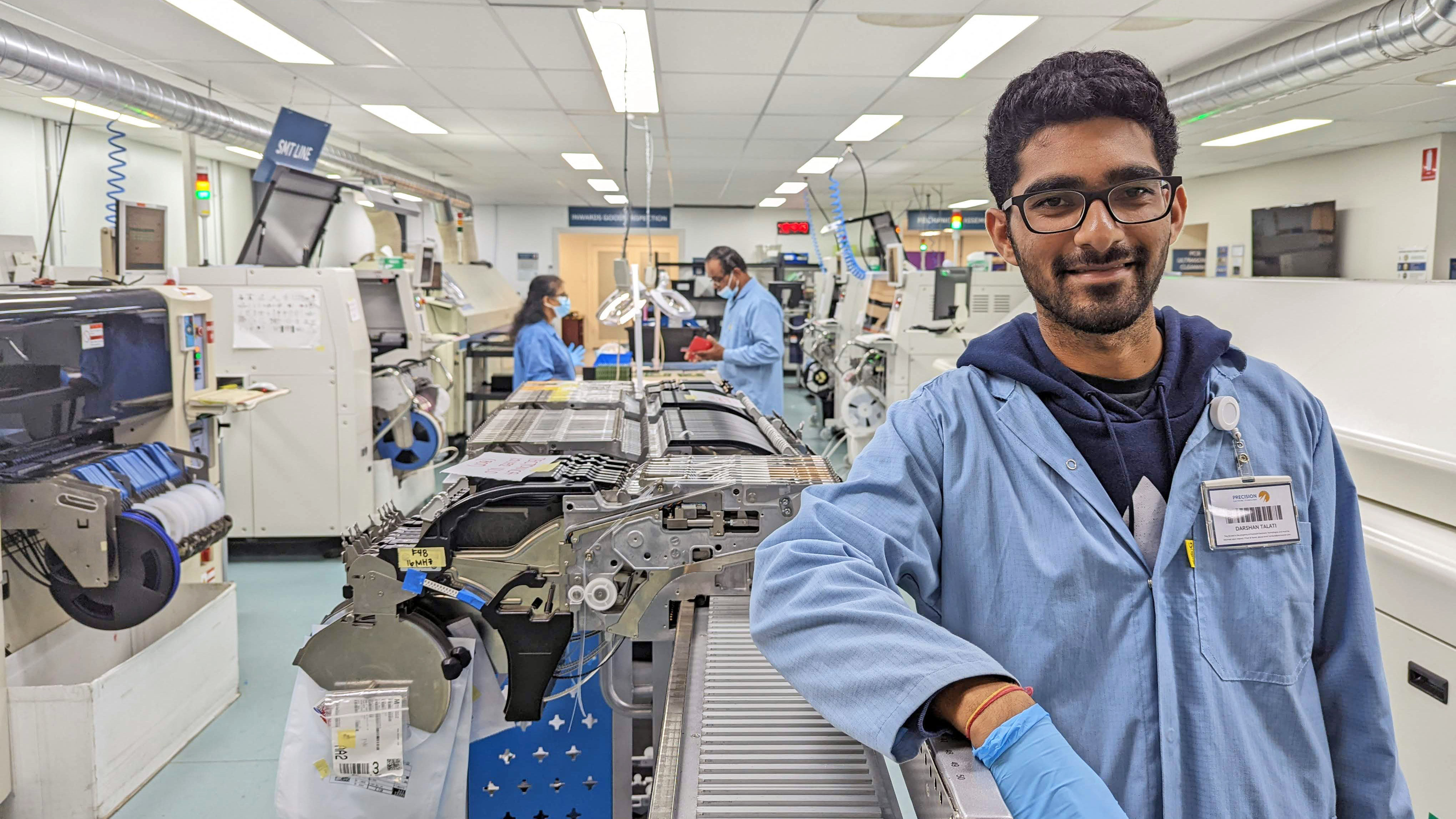 Pic of engineer leaning against machine