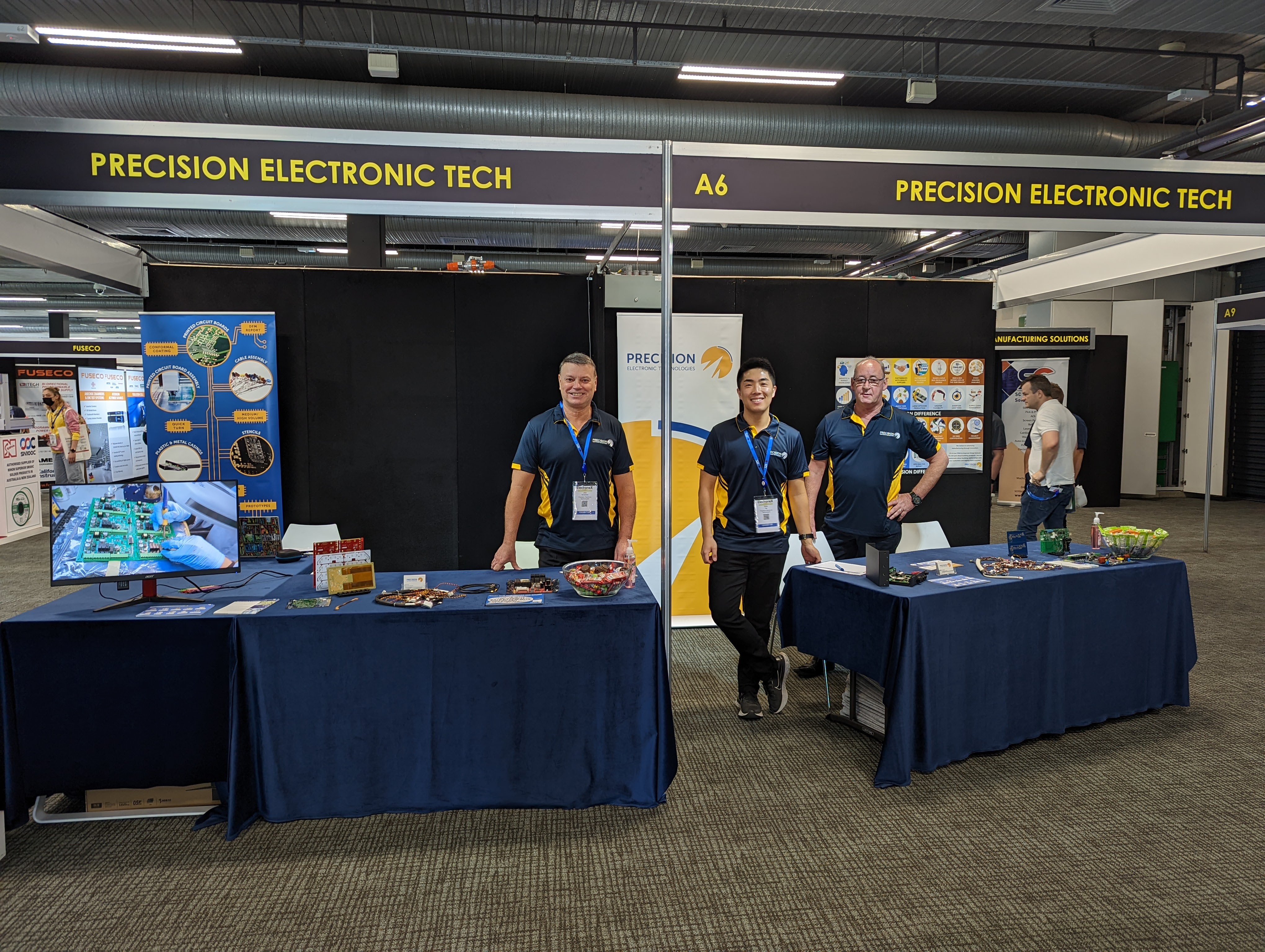 3 members of the Precision Team at the Electronex Booth